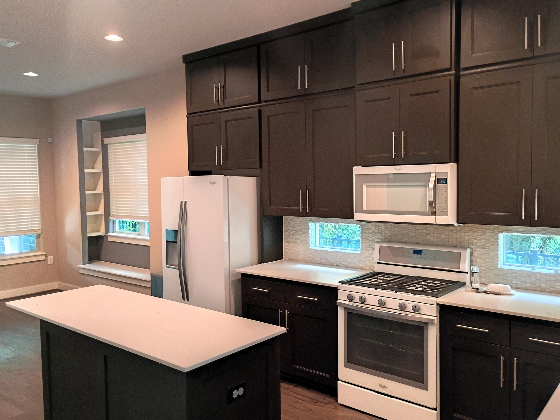Kitchen after cabinet-finish touch-ups, wall-paint touch-ups, and final make-ready work in Austin.