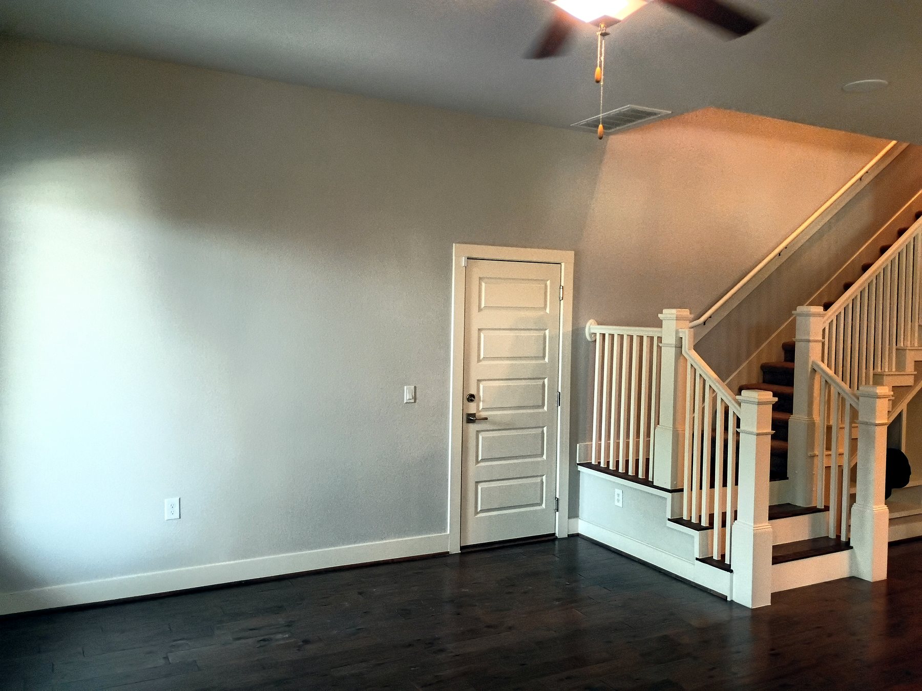 Living area after wall, trim, and finish touch-ups for an Austin residential make-ready.